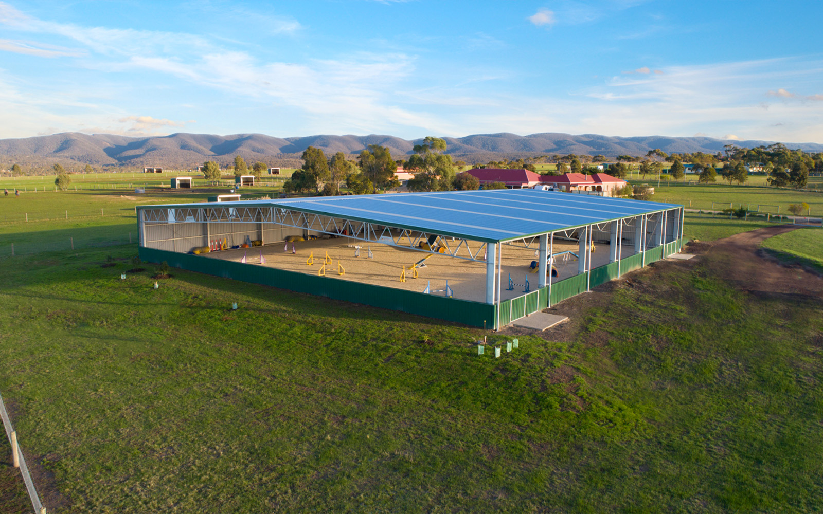 Sandy Stockman indoor jumping arena 